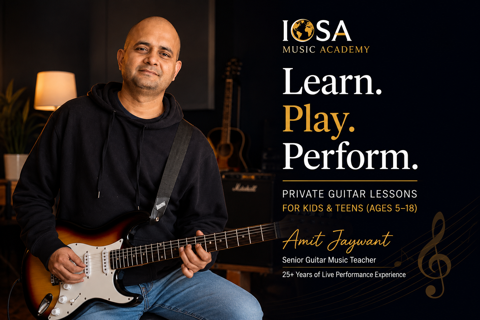 Amit Jaywant, Senior Guitar Music Teacher at IOSA Music Academy, holding an electric guitar